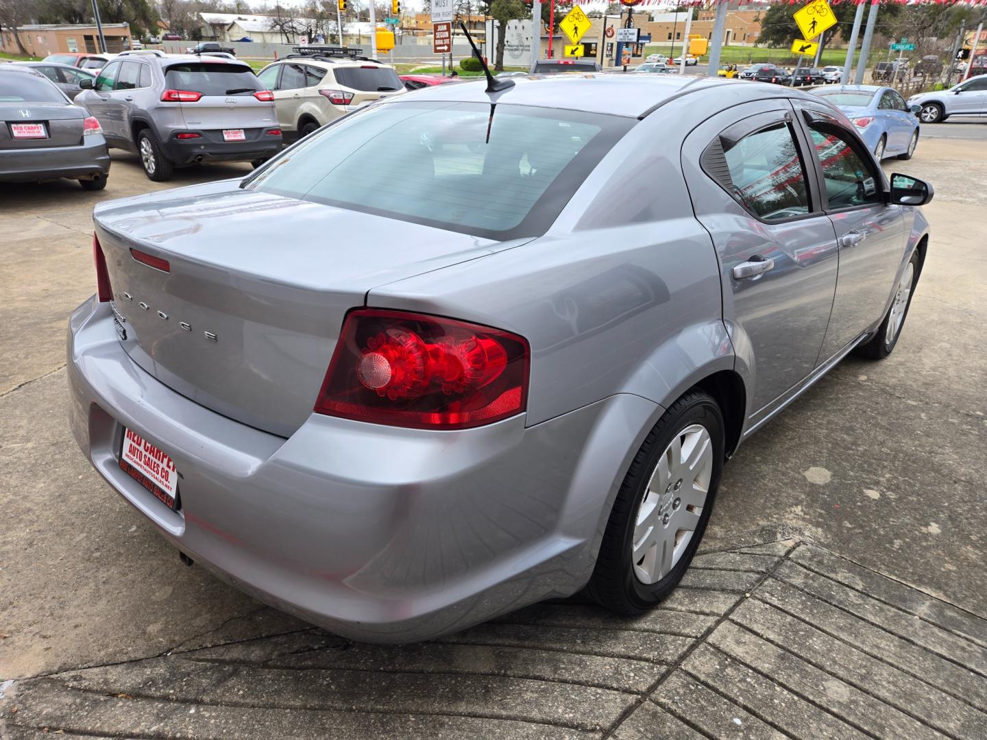 2014 SILVER Dodge Avenger SE (1C3CDZAB1EN) with an 2.4L L4 DOHC 16V engine, 4-Speed Automatic transmission, located at 503 West Court, Seguin, TX, 78155, (830) 379-3373, 29.568621, -97.969803 - Photo#2